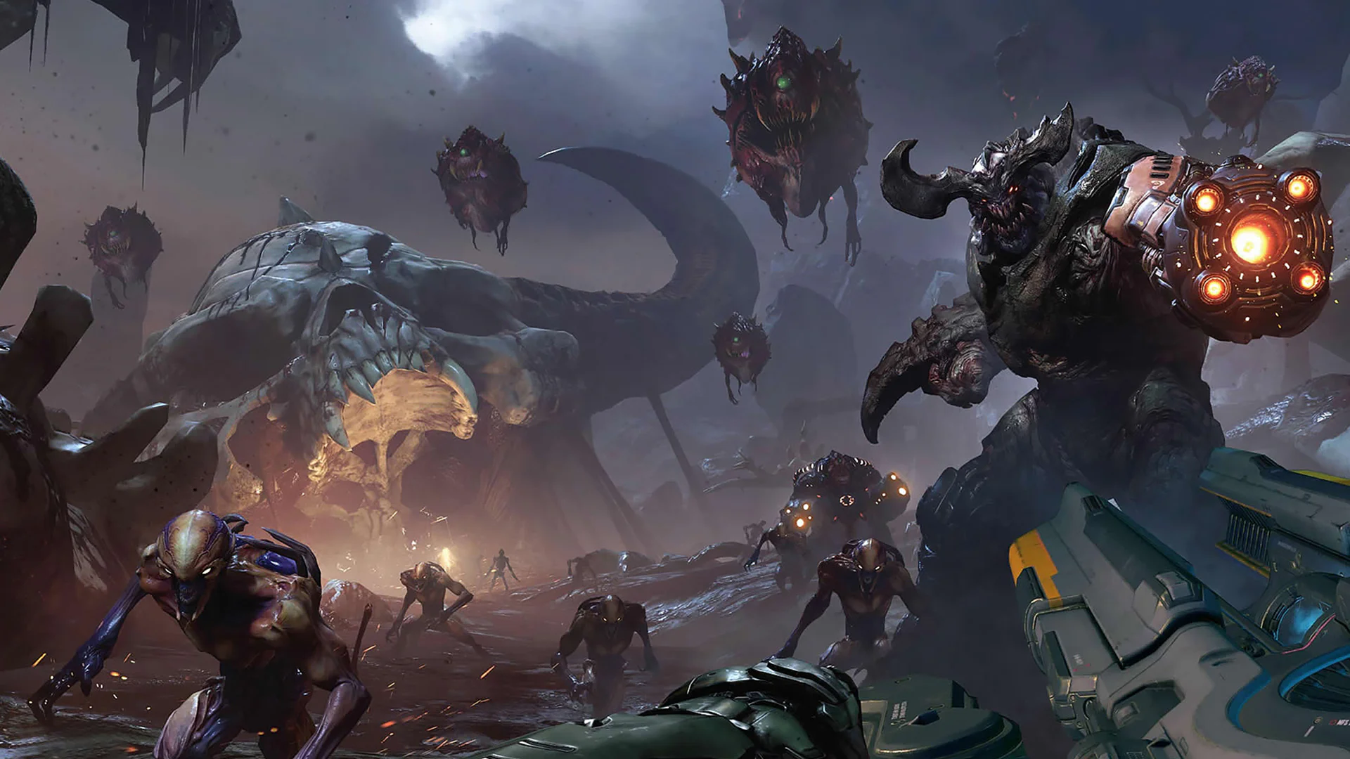 Сцена боя с демонами в игре Doom, главный герой сражается с многочисленными монстрами в адском пейзаже.