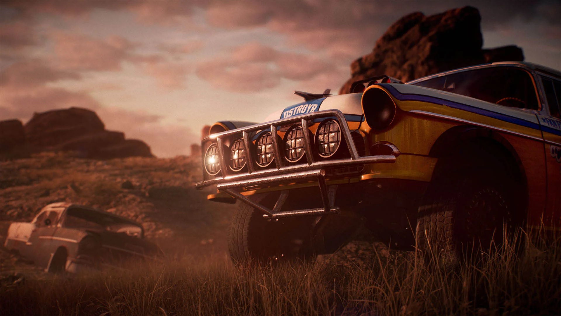Скриншот из игры Need for Speed Payback, демонстрирующий внедорожный автомобиль в пустынной местности на фоне заката.