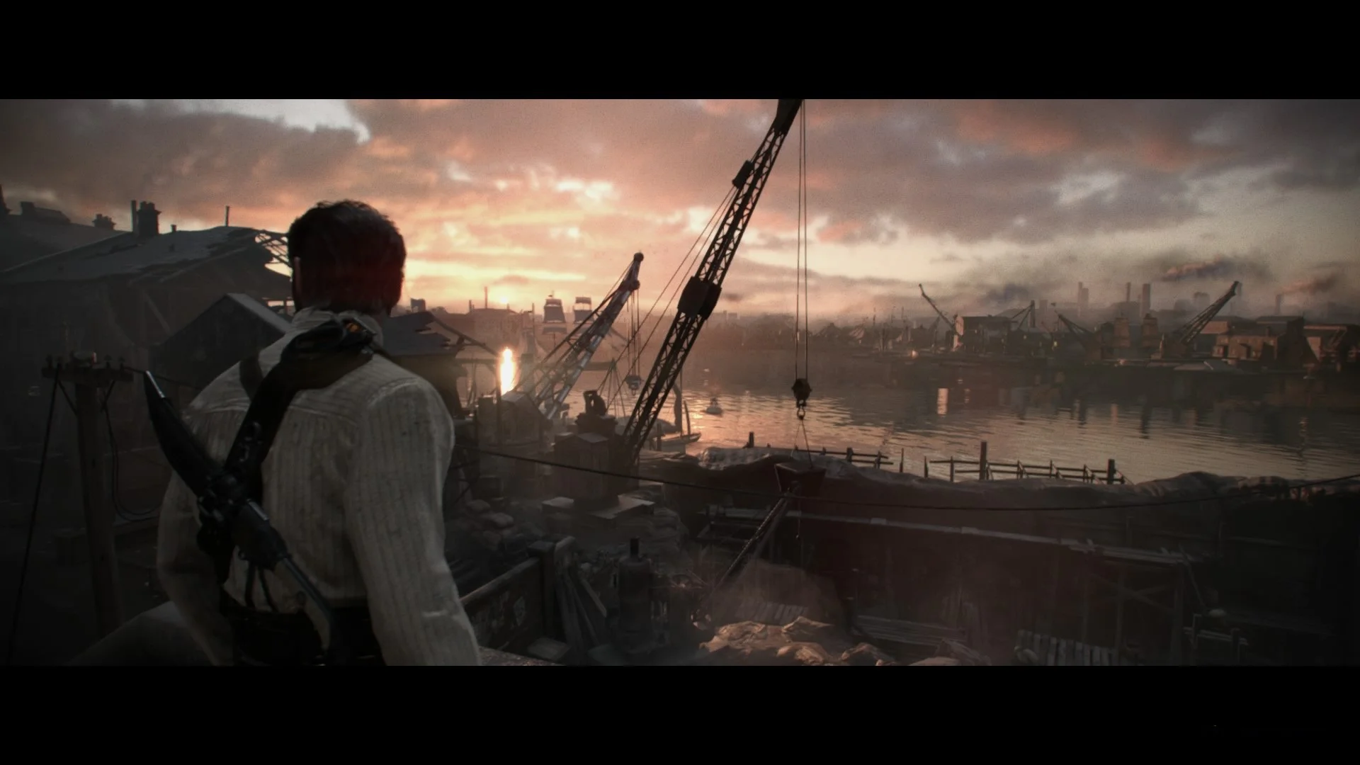 Главный герой The Order: 1886 смотрит на индустриальный пейзаж в Лондоне на закате.