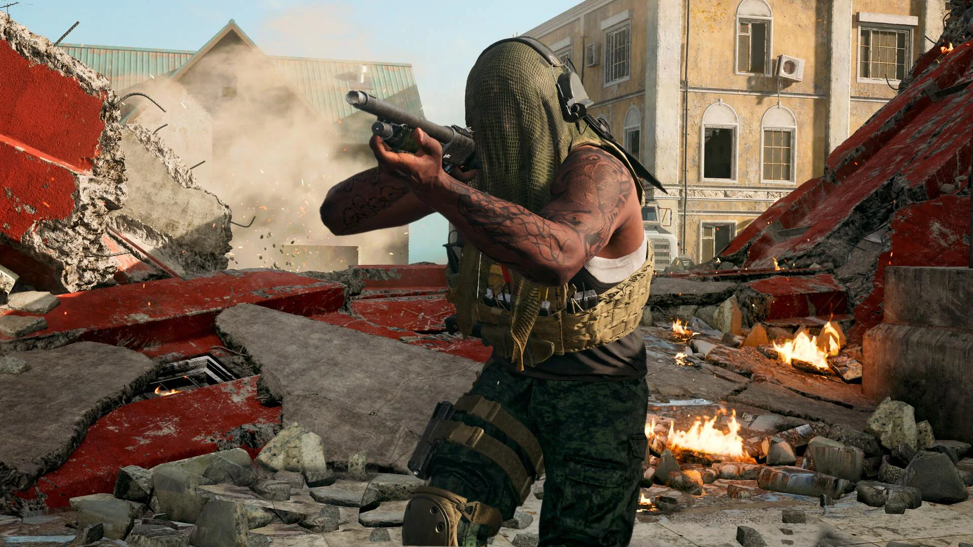 Солдат в маске целится из оружия среди разрушенных зданий в игре Call of Duty Modern Warfare 3.