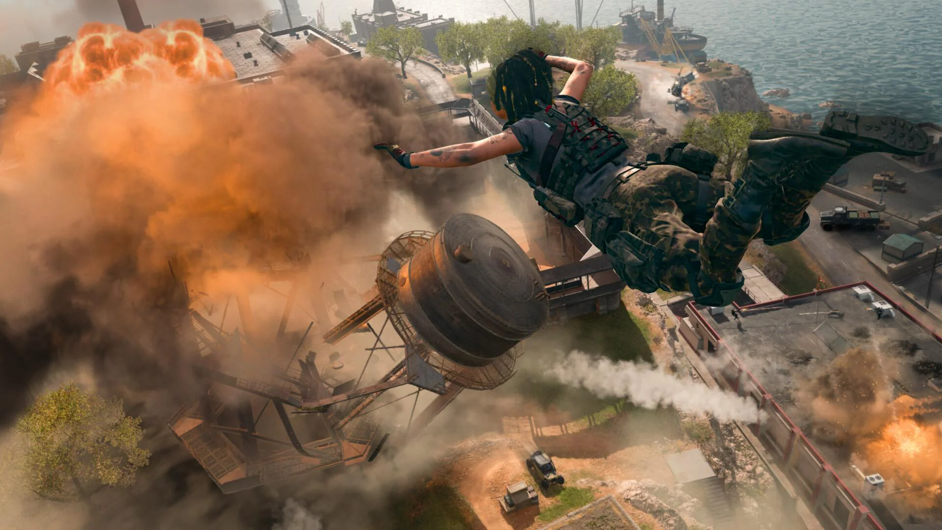 Солдат парашютирует над разрушенным городом с взрывами в игре Call of Duty Modern Warfare 3.
