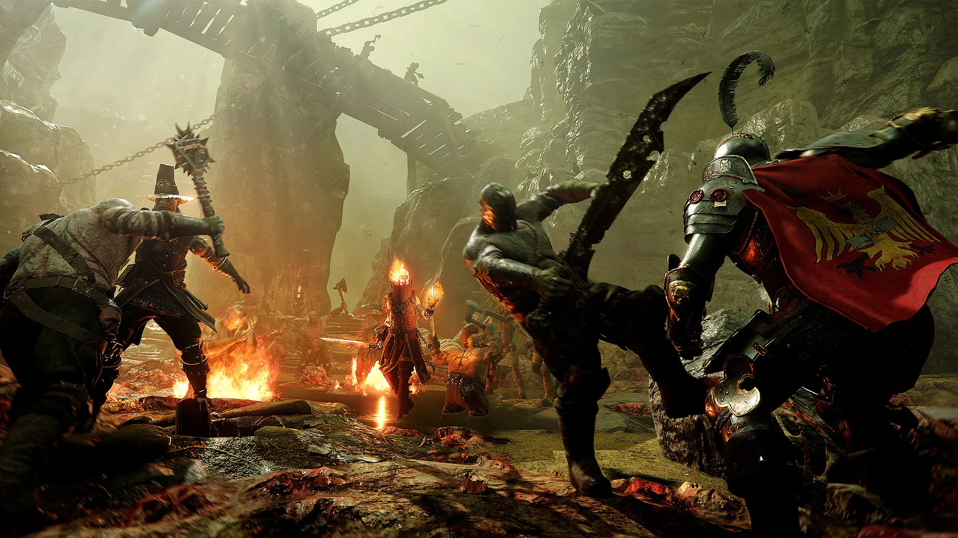 Герои сражаются с врагами у огня в игре Warhammer Vermintide 2