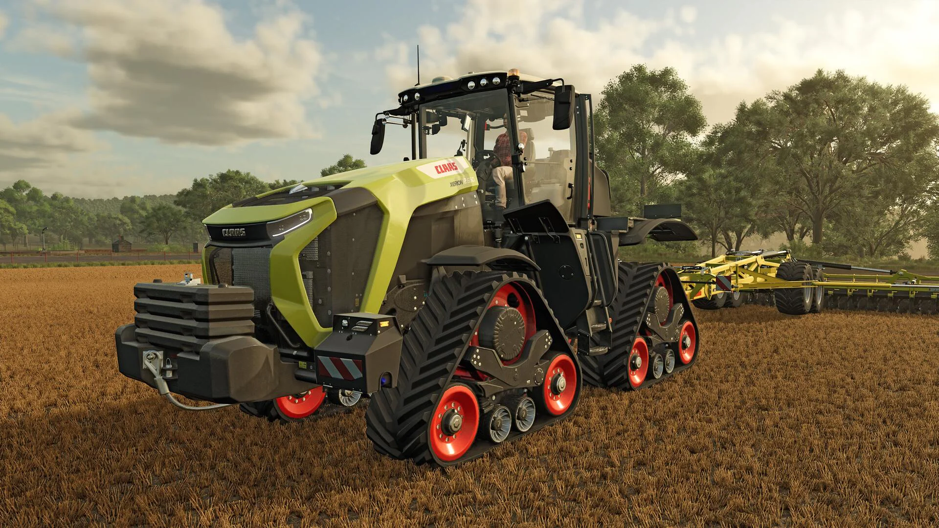 Гусеничный трактор Claas Xerion 12.590 работает в поле с сельскохозяйственным оборудованием в Farming Simulator 25
