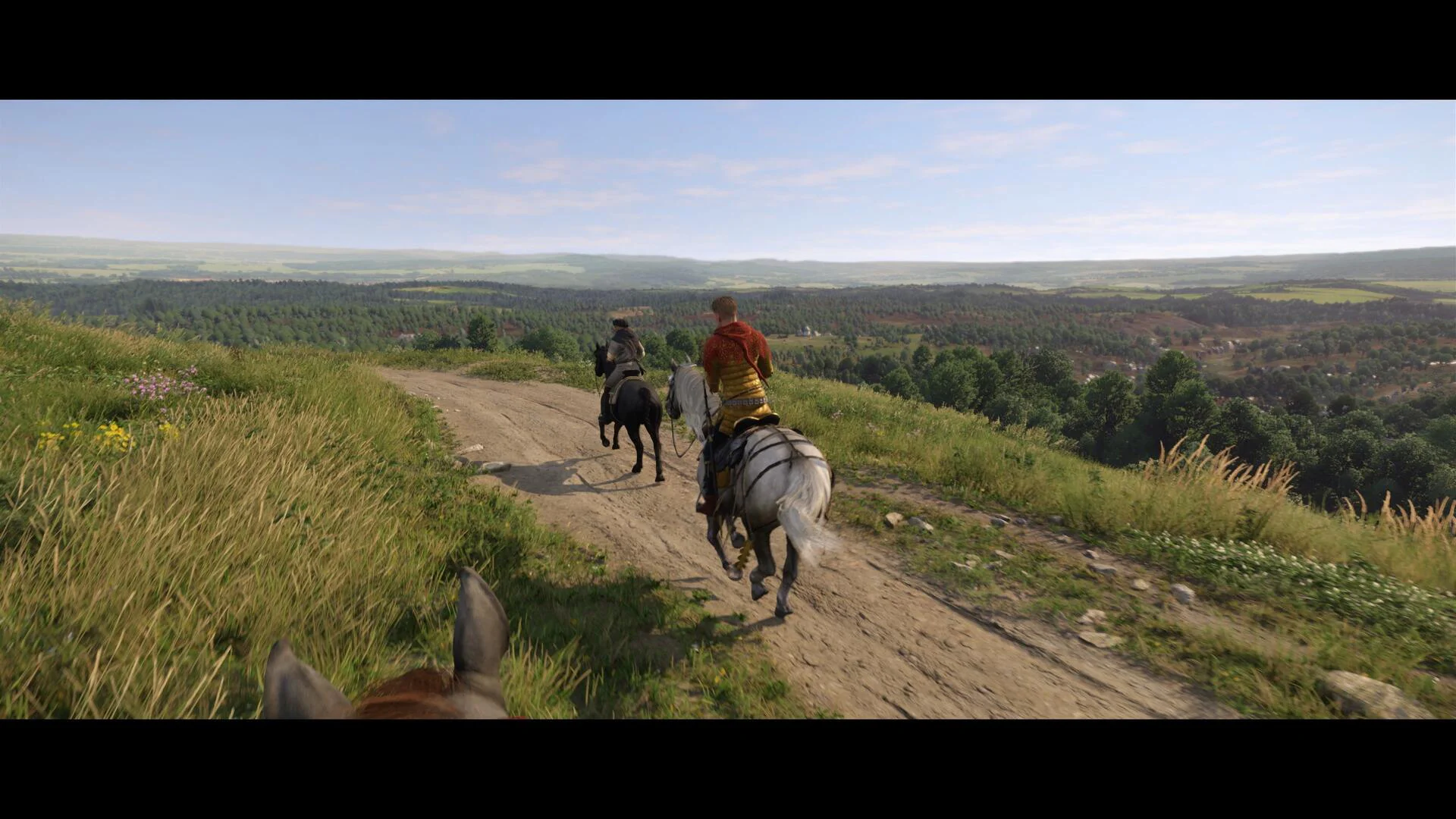 Конные путешественники исследуют средневековый мир в Kingdom Come: Deliverance