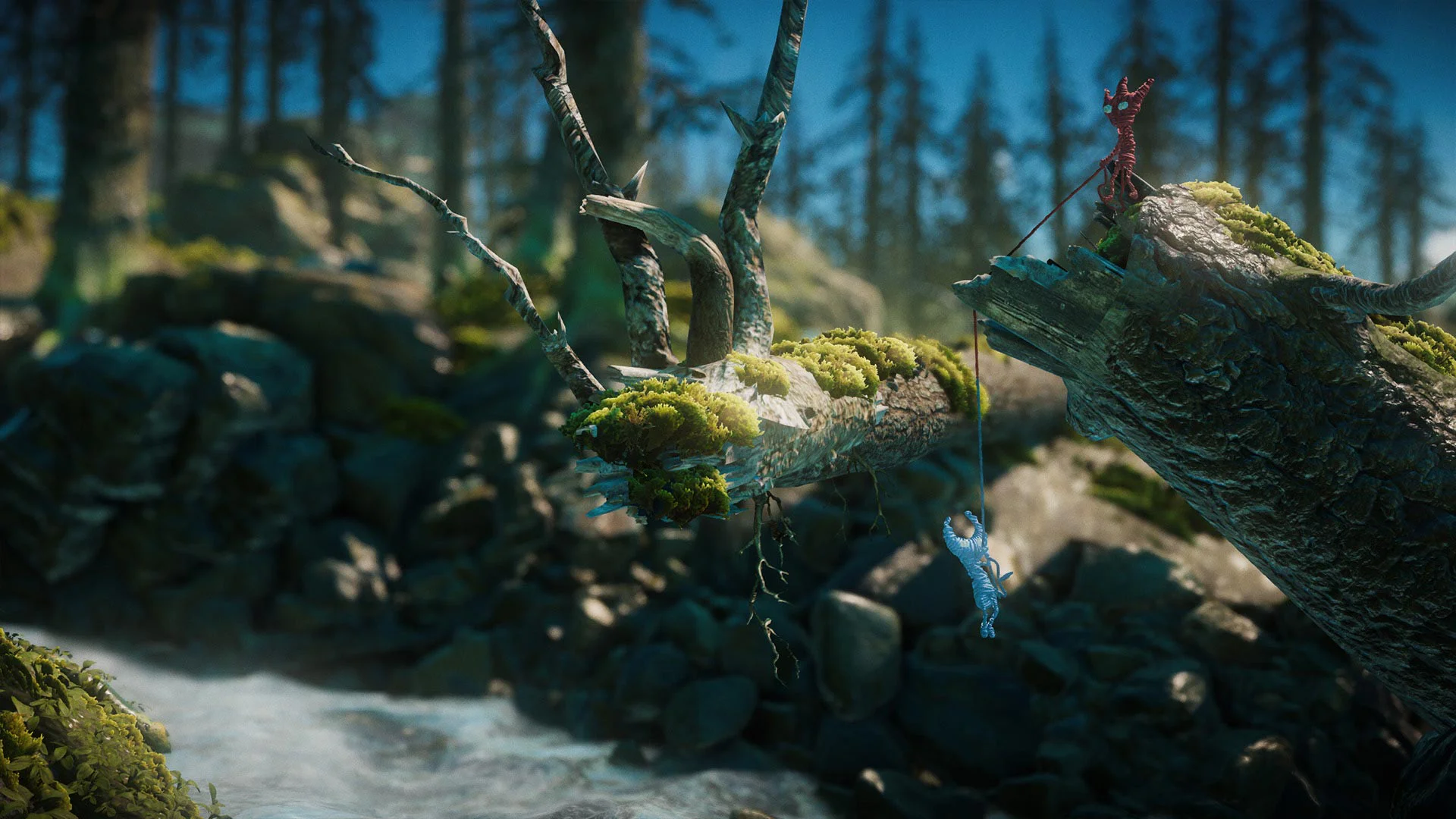 Красный Ярни помогает синему напарнику перебраться через реку в Unravel Two