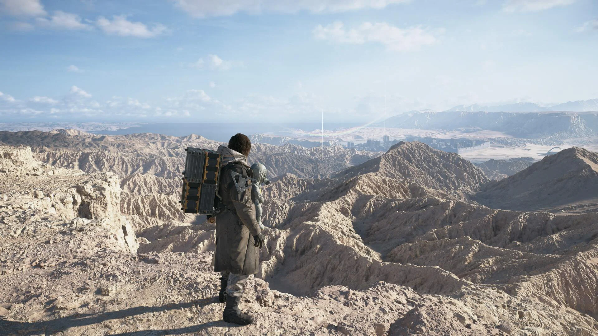 Сэм смотрит на пустыню в Death Stranding 2 для аренды